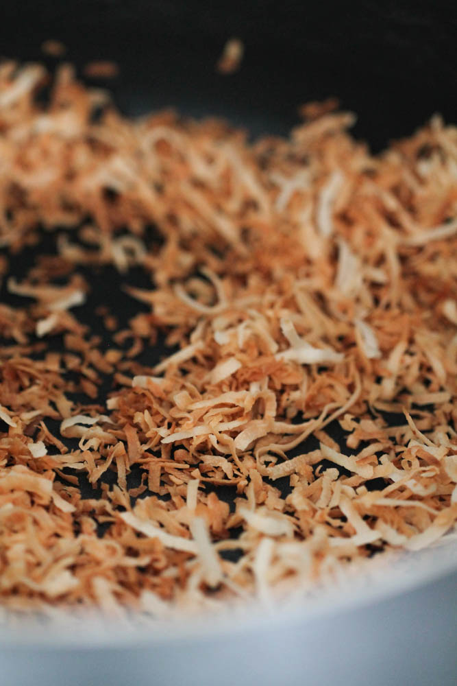 Shredded toasted coconut in a large pan