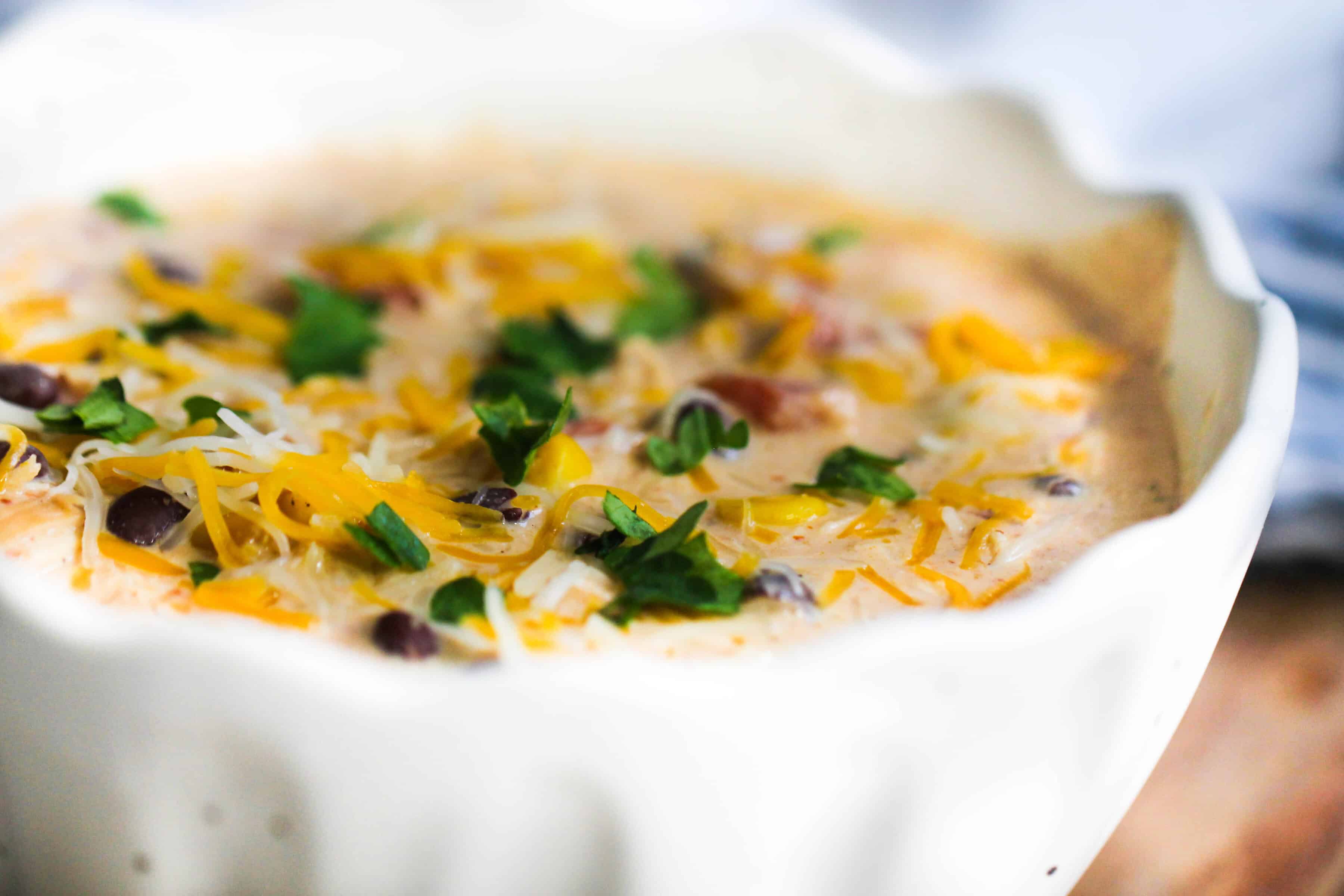 Instant Pot Cream Cheese Chili ready to eat in a soup bowl