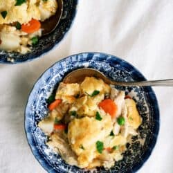 cheesy chicken pot pie on a blue plate
