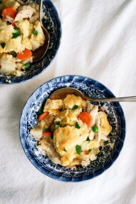 cheesy chicken pot pie on a blue plate