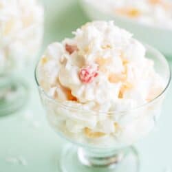 Close up of a glass filled with a serving of Easy Ambrosia Salad.