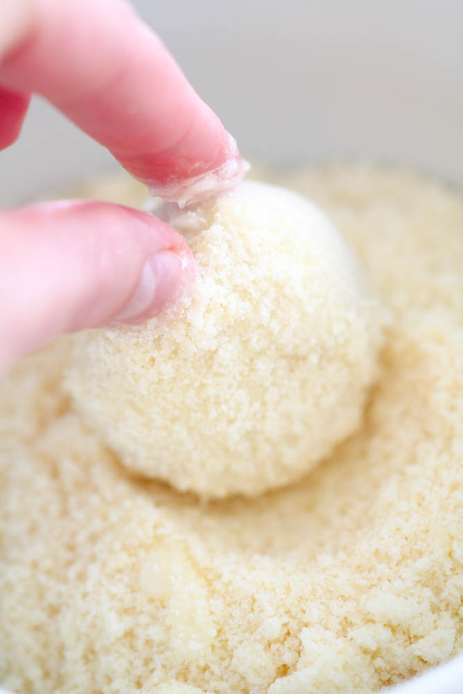Rolling frozen roll in parmesan cheese mixture