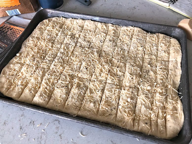 Sheet Pan Garlic Breadsticks in sheet pan ready to cook