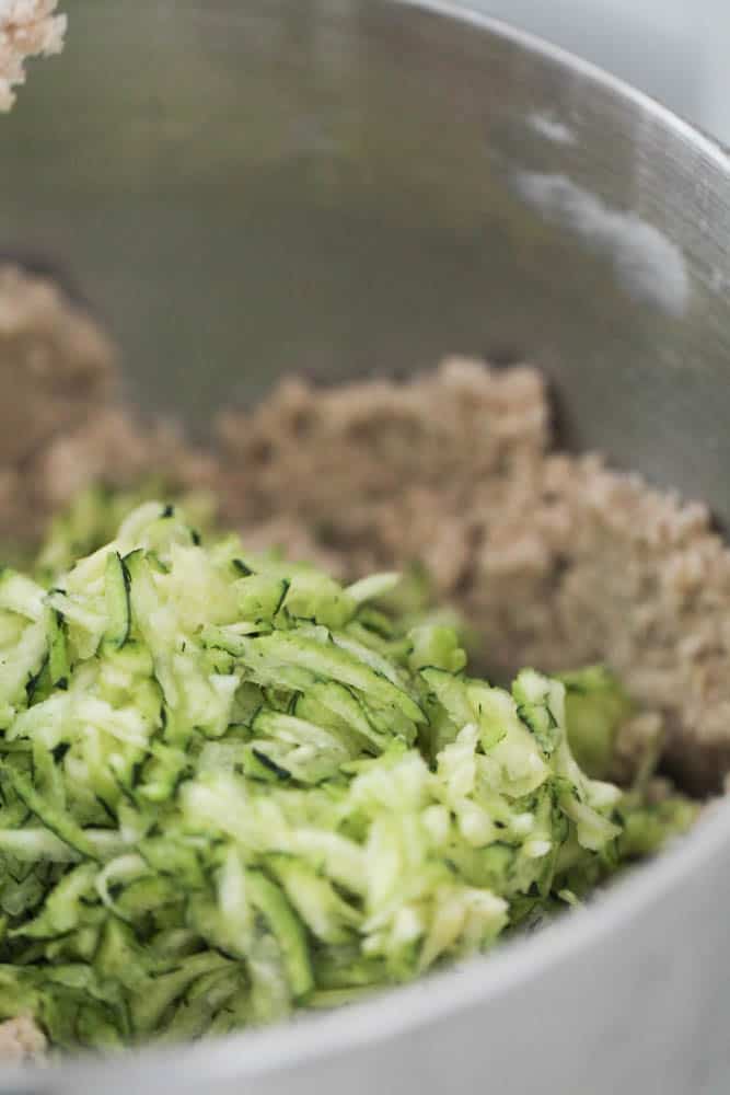 Adding shredded zucchini to cookie dough