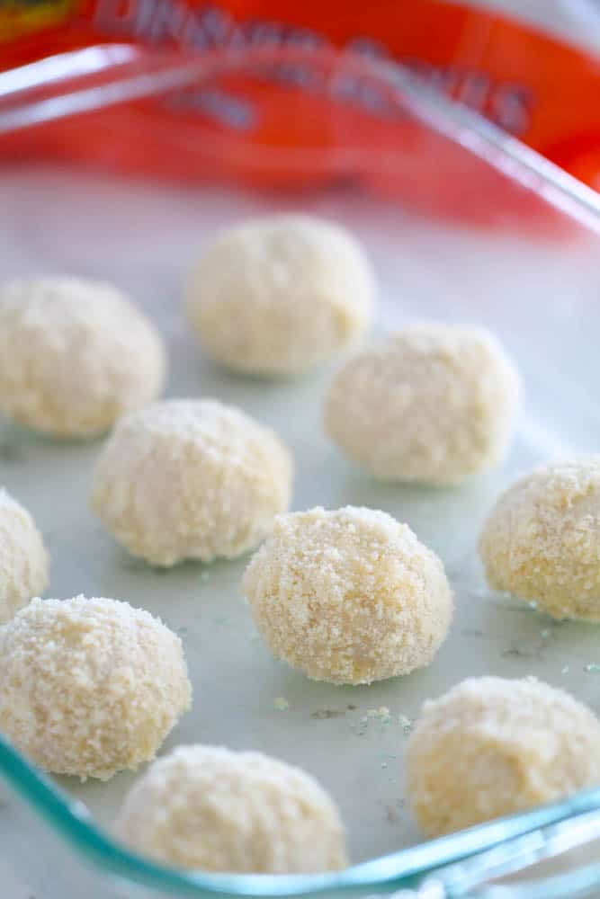 Unbaked 3 Ingredient Parmesan Rolls on a baking dish