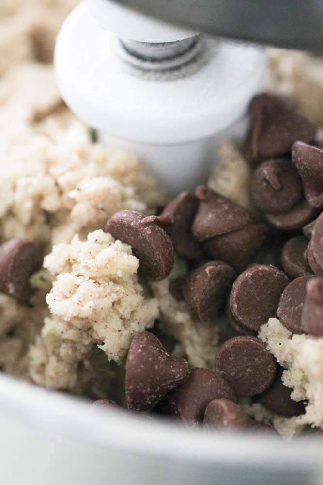 Adding chocolate chips to cookie dough