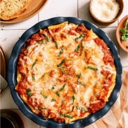 Top view of Baked Ziti in a round baking dish.