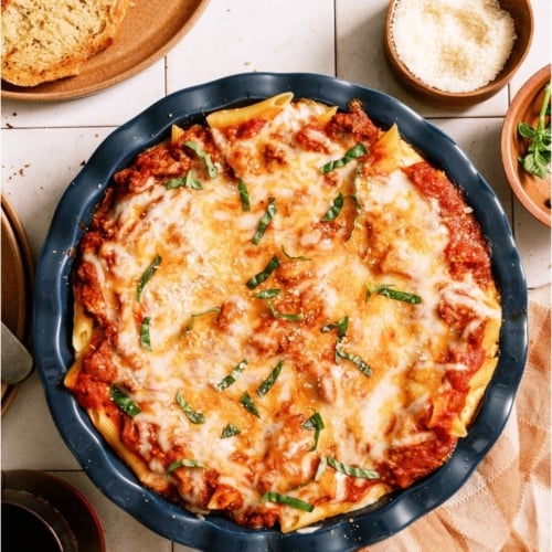 Top view of Baked Ziti in a round baking dish.