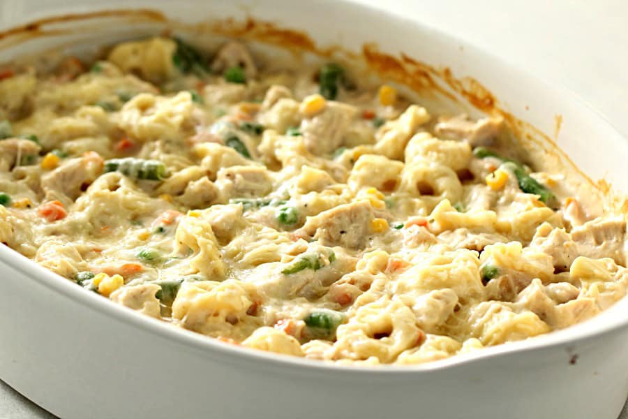 Chicken Alfredo Tortellini Casserole in a white casserole dish