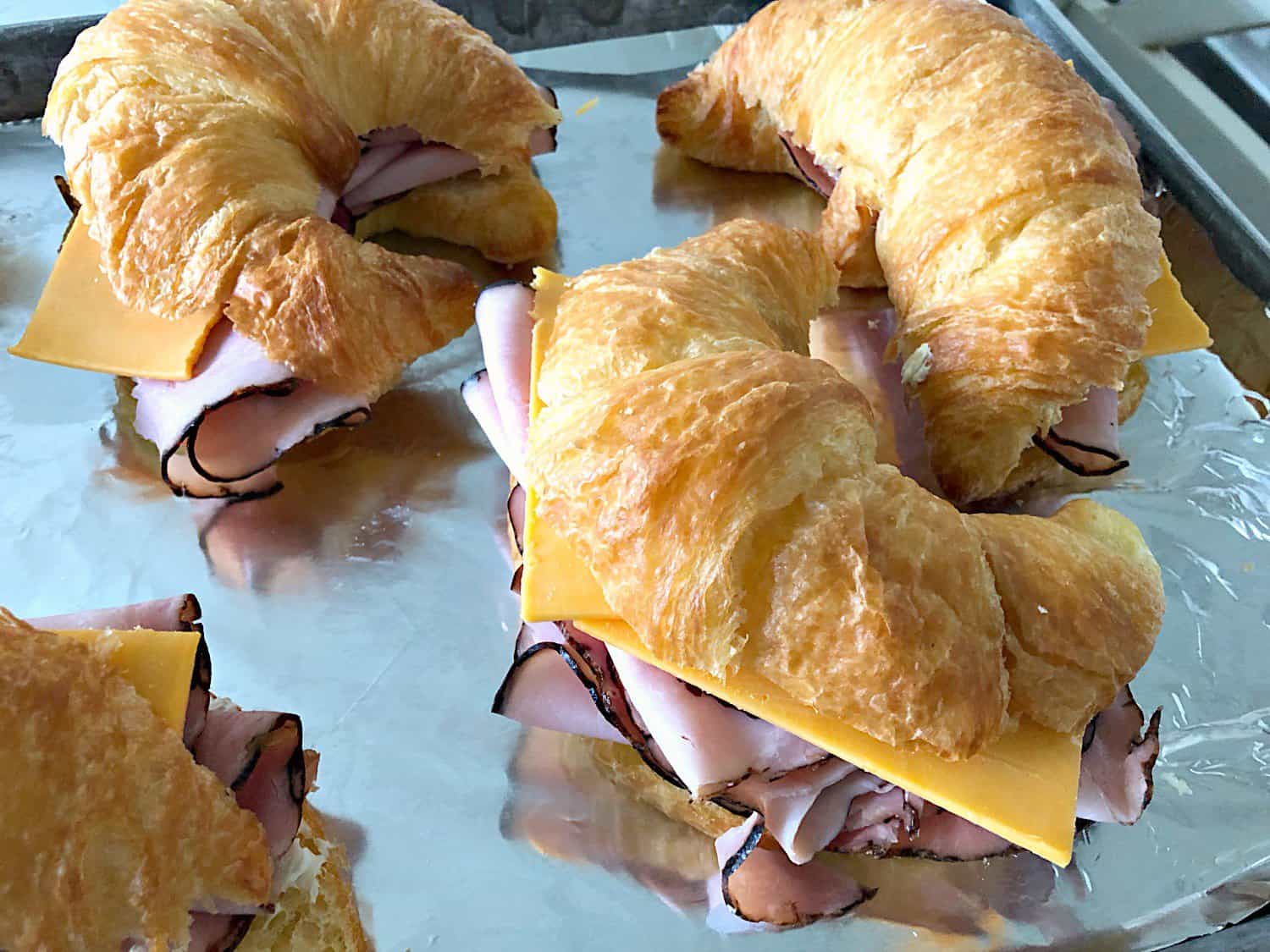 Ham and Cheese Croissant Sandwiches on sheet pan ready to bake