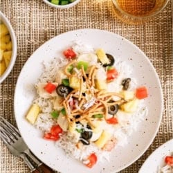 A plate with a serving of Hawaiian Haystacks with toppings.