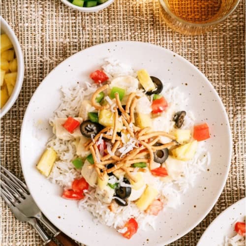 A plate with a serving of Hawaiian Haystacks with toppings.