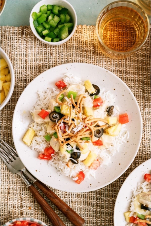 A plate with a serving of Hawaiian Haystacks with toppings.