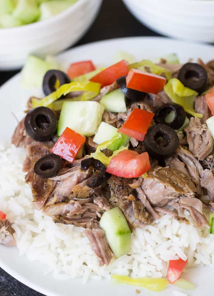 Instant Pot Kalua Pork served over rice and topped with vegetables