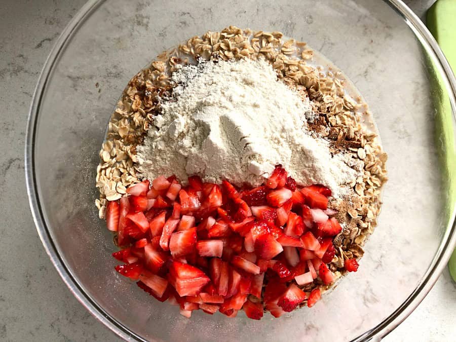 oatmeal, strawberries and protein powder in a bowl