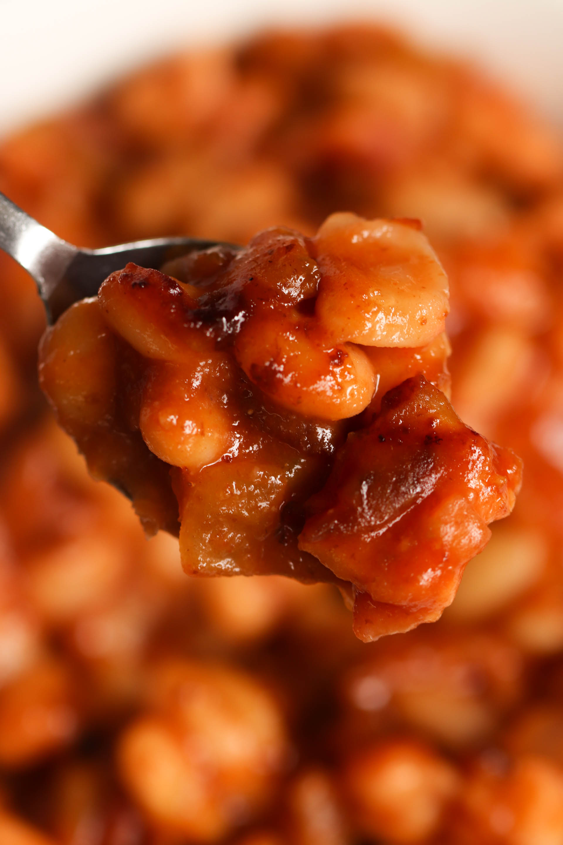 Close up spoonful of Instant Pot Sweet and Spicy BBQ Beans