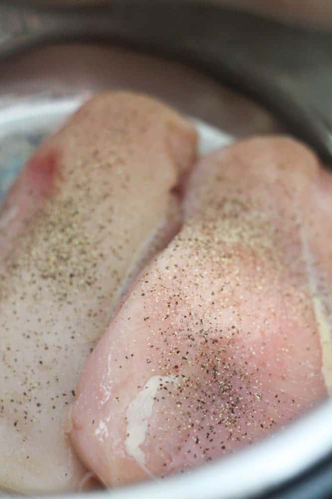 chicken with salt and pepper in an instant pot