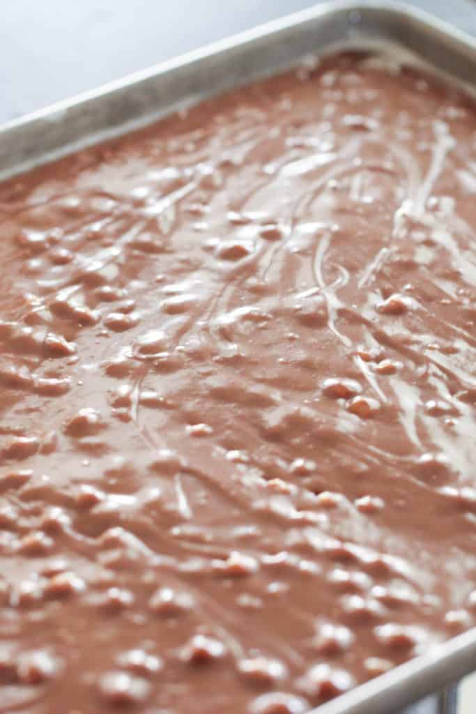 Turtle Texas Sheet Cake batter poured into a sheet pan.
