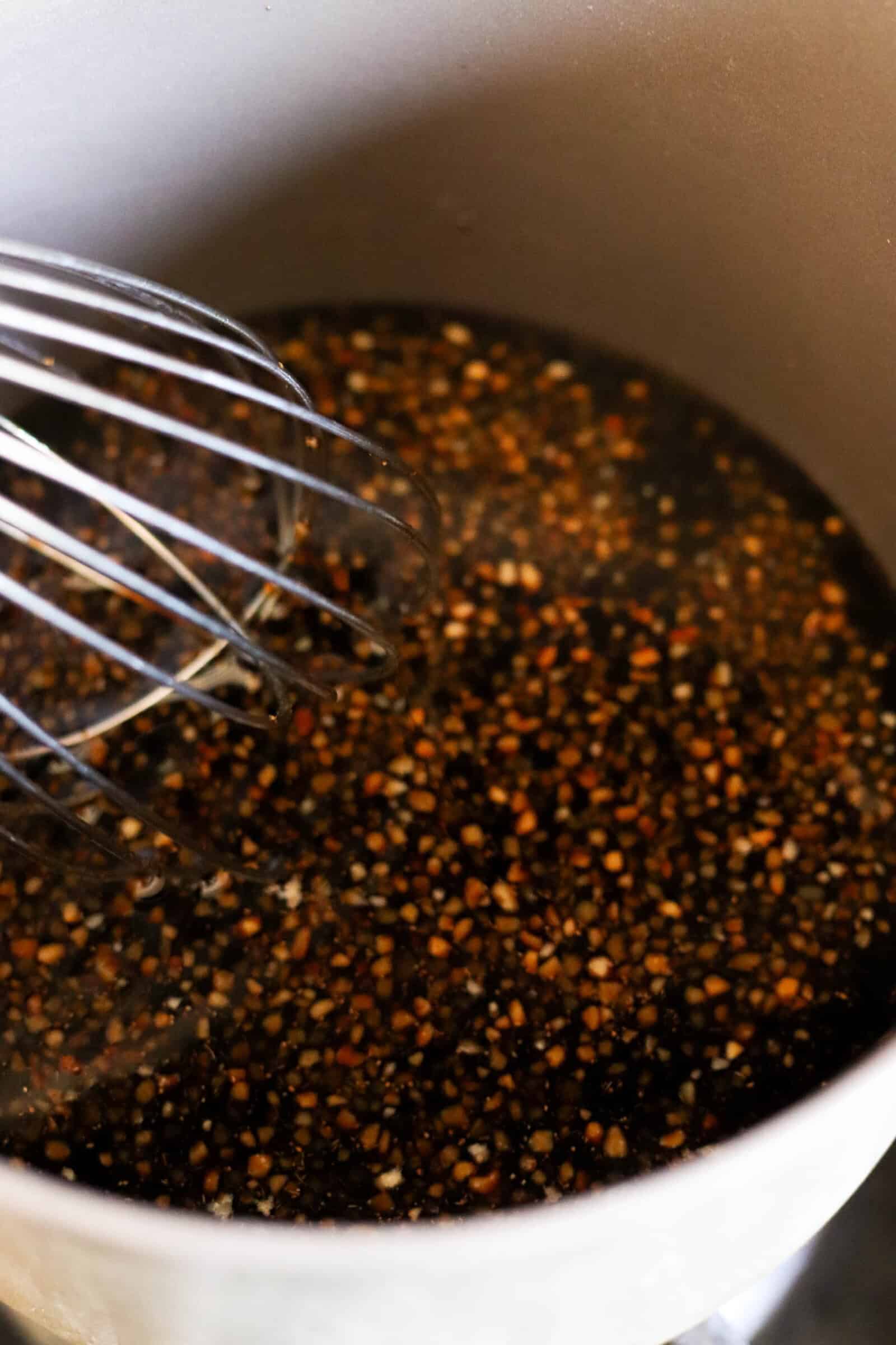 Sticky Asian Sauce for the ribs in bowl with whisk