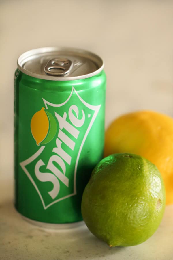 Can of sprite with a lemon and lime