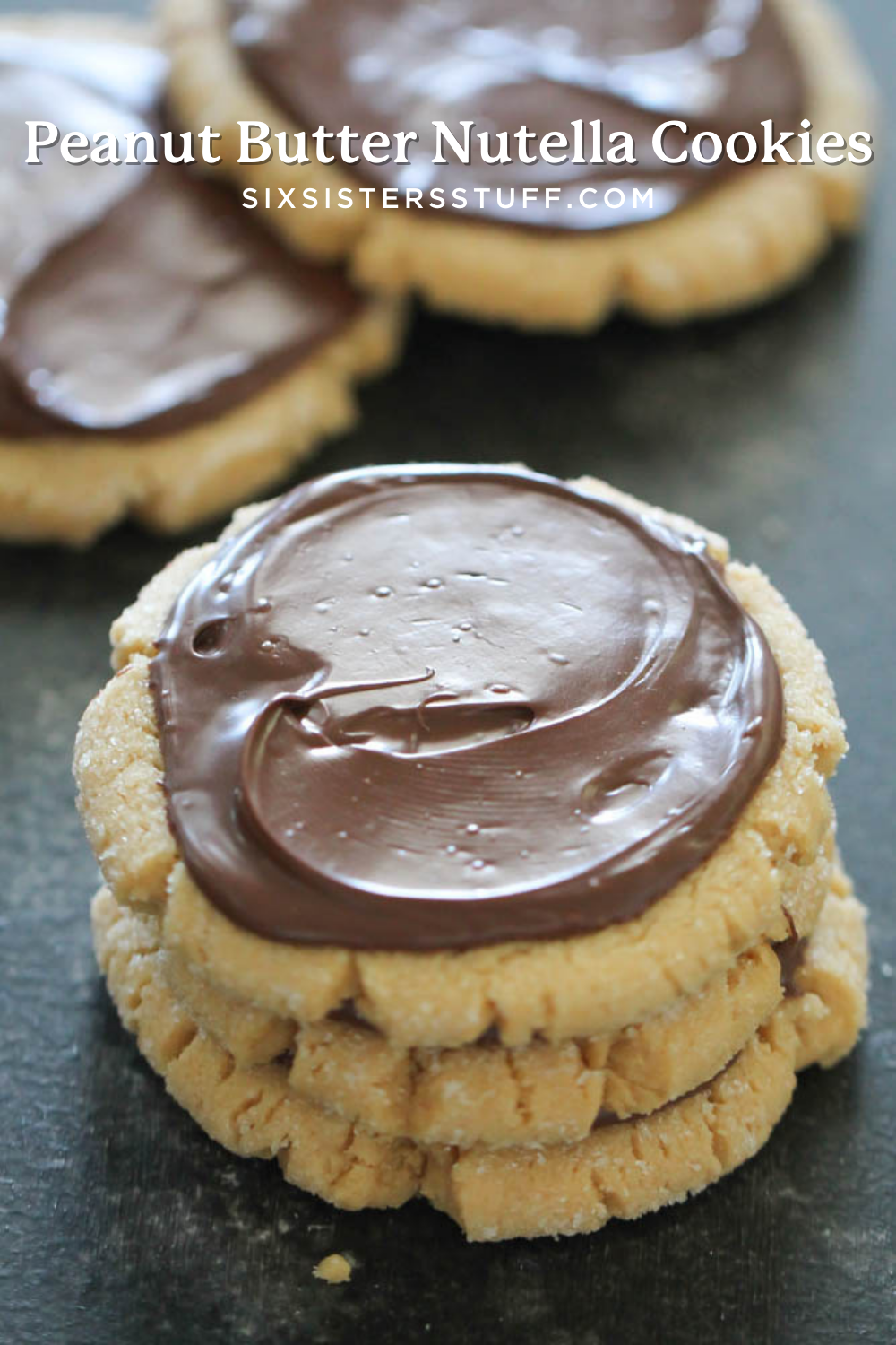 frosted peanut butter cookies with nutella on top