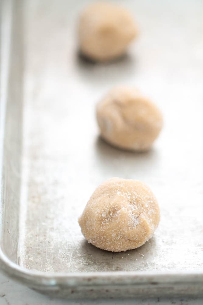 Cookie dough balls on baking sheet