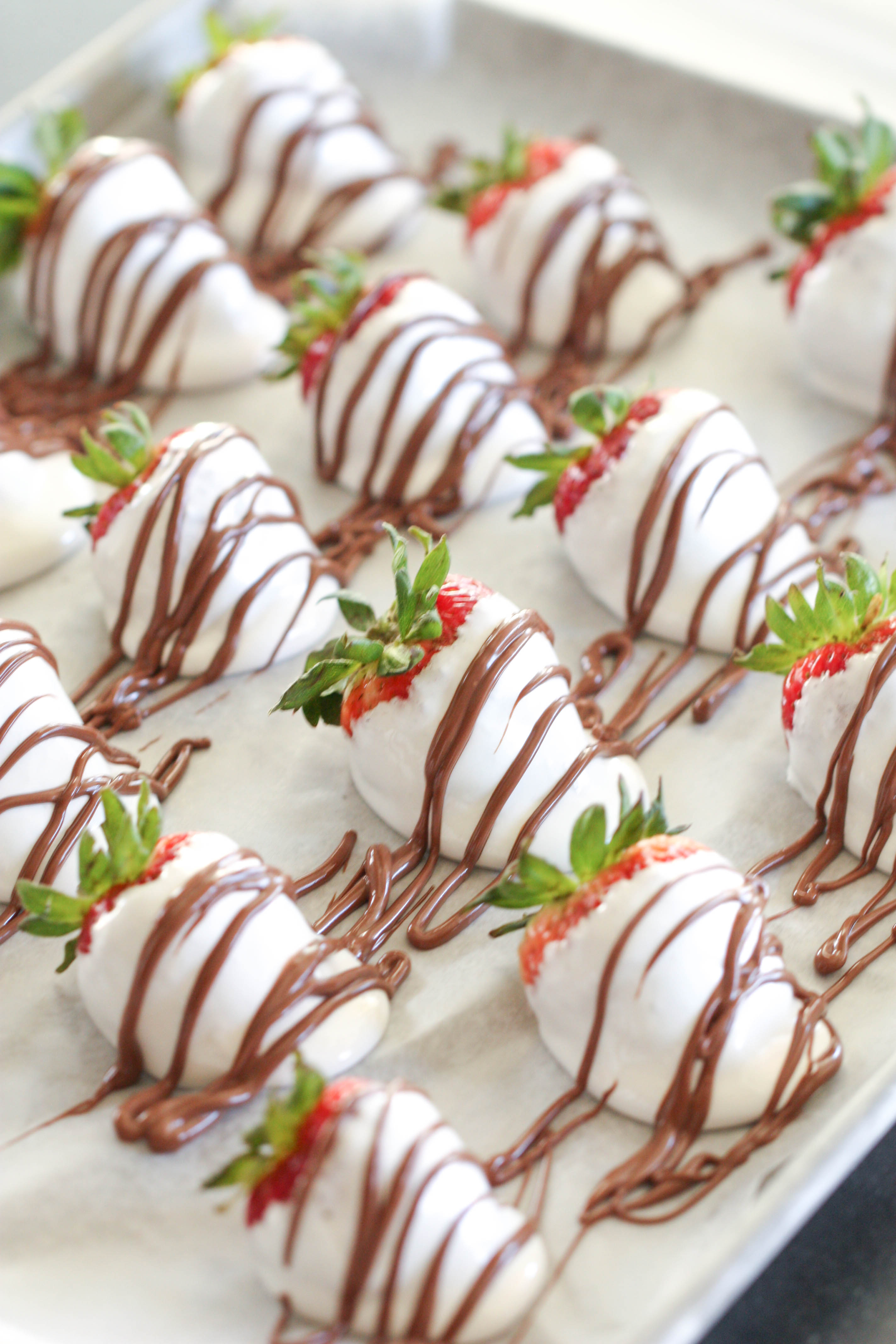S’mores Dipped Strawberries on a sheet pan without the graham cracker crumbs