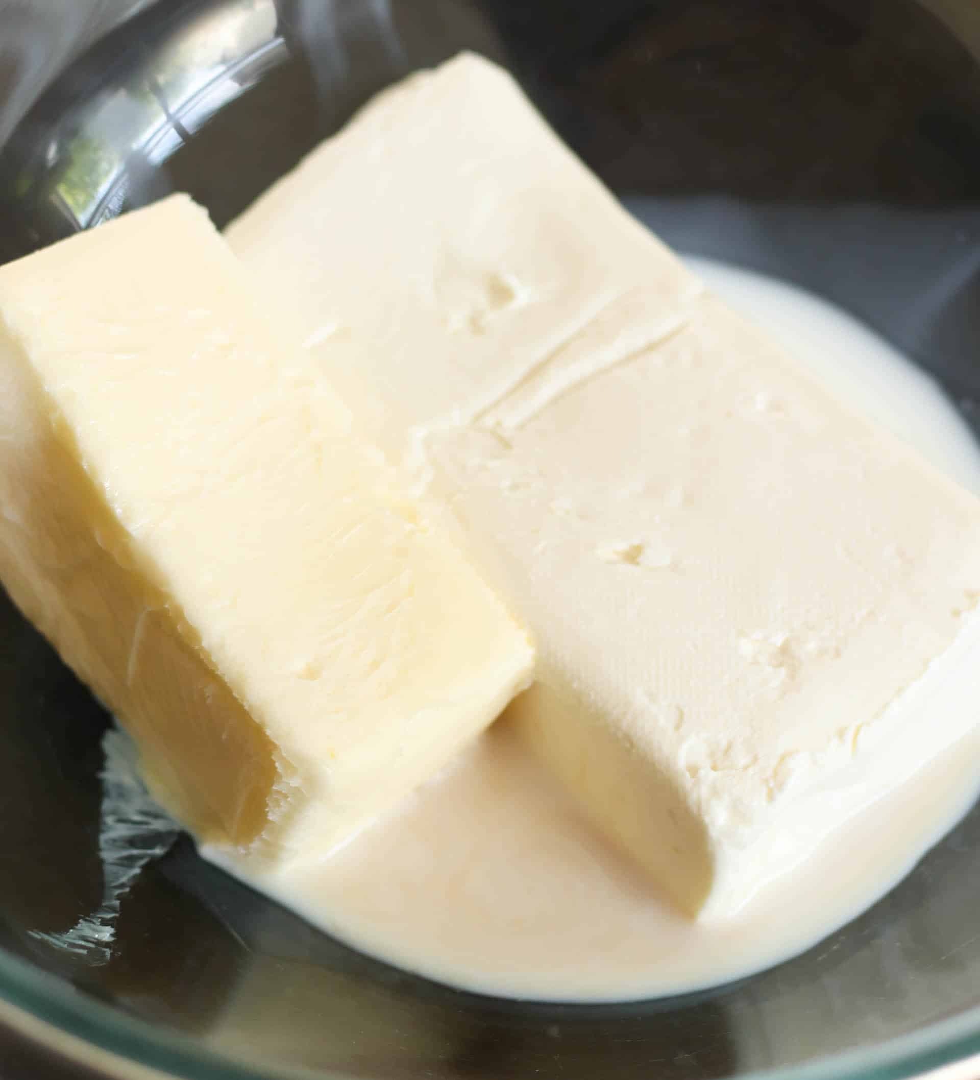 Ingredients for cream cheese frosting in a bowl