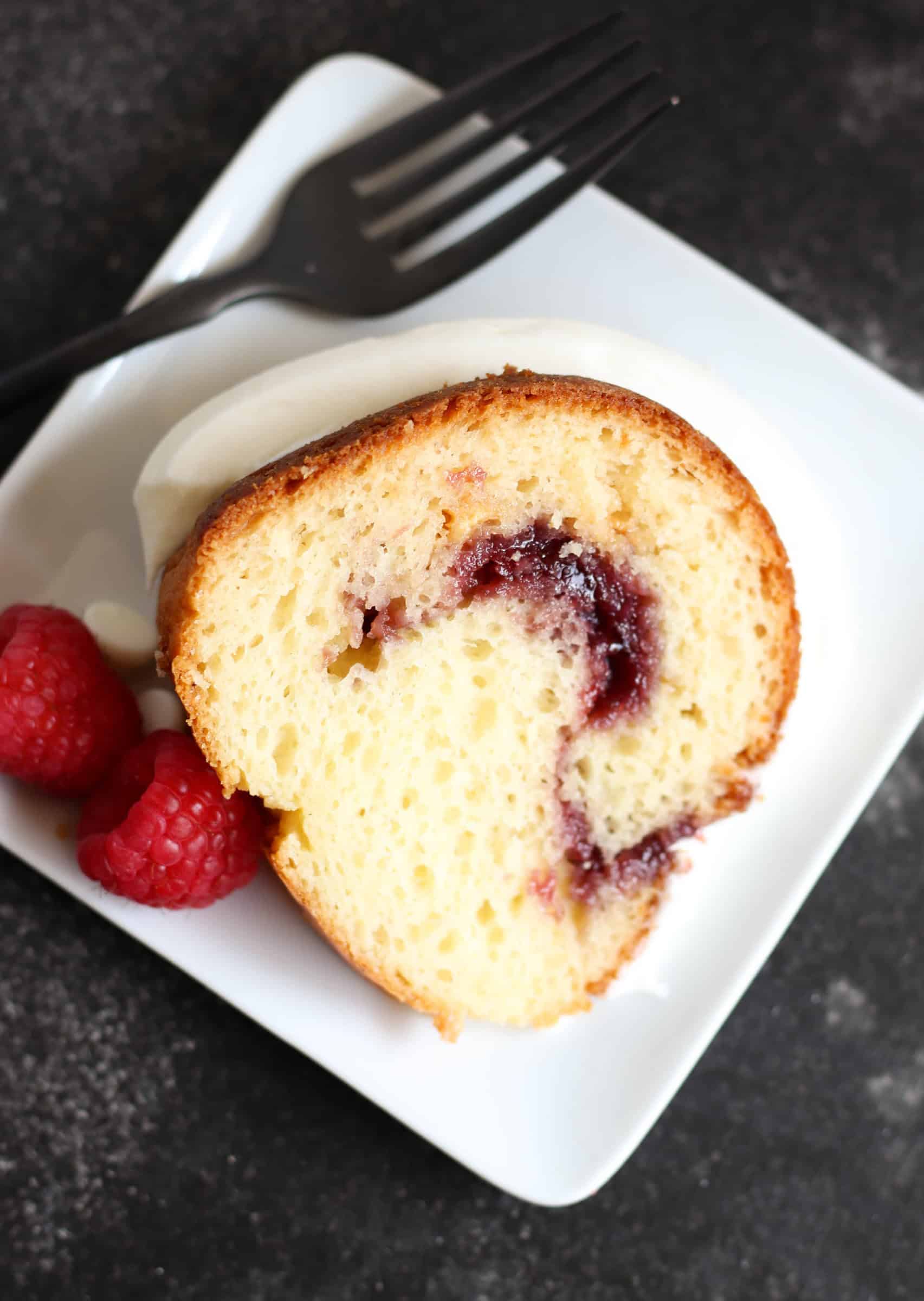 Slice of White Chocolate Raspberry Bundt Cake on a plate