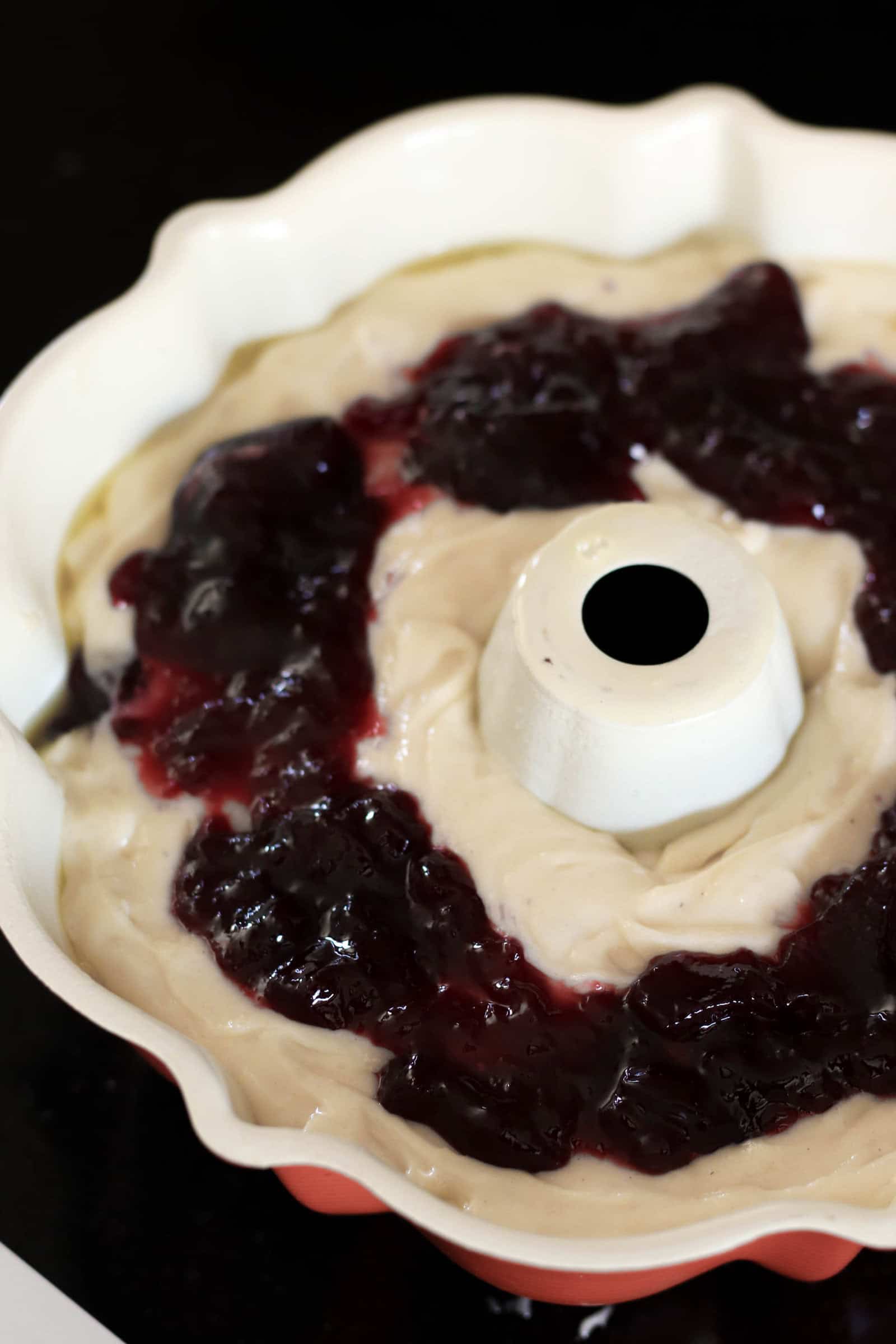 White Chocolate Raspberry Bundt Cake batter in  bundt cake pan