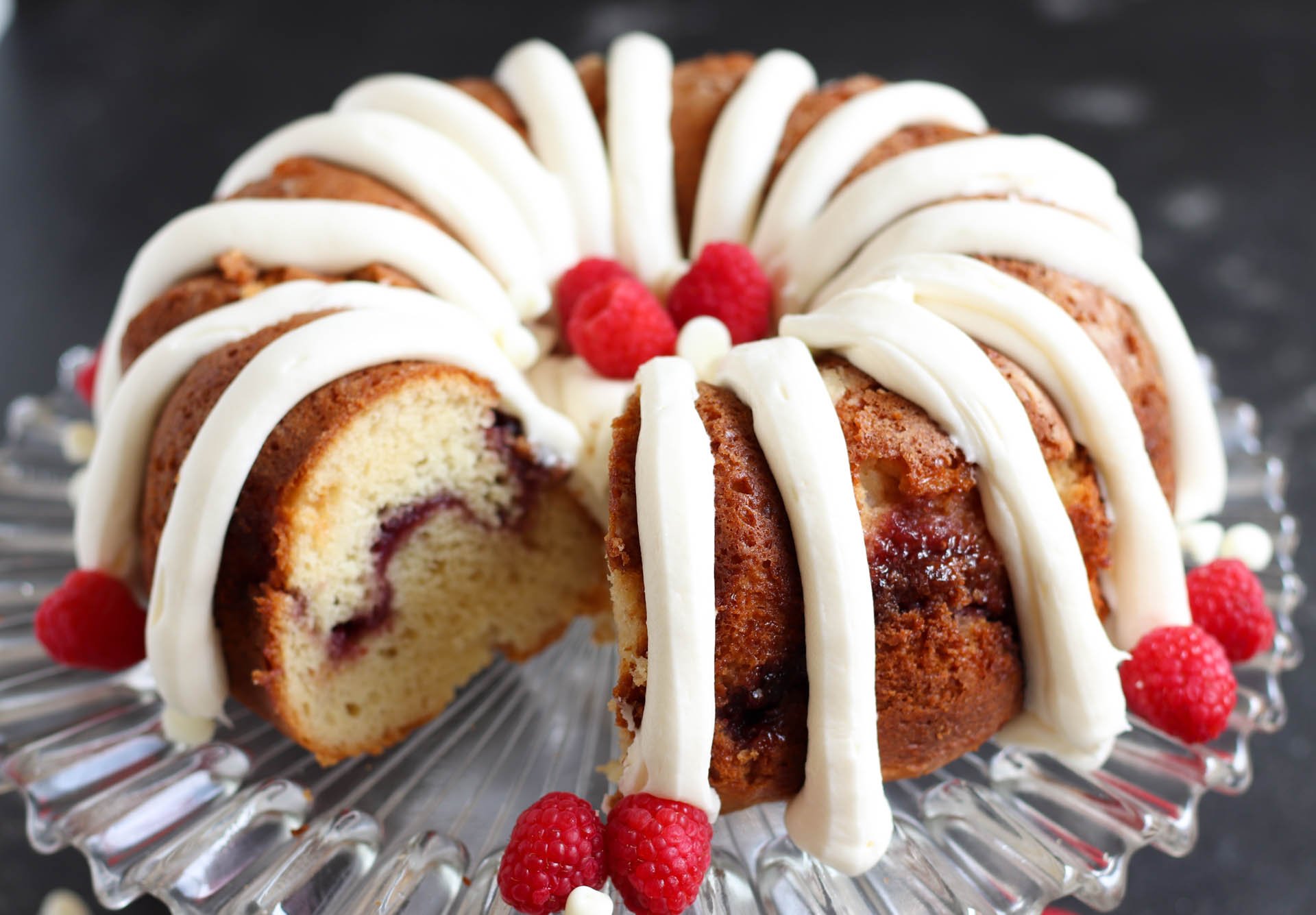 White Chocolate Raspberry Bundt Cake with a slice missing