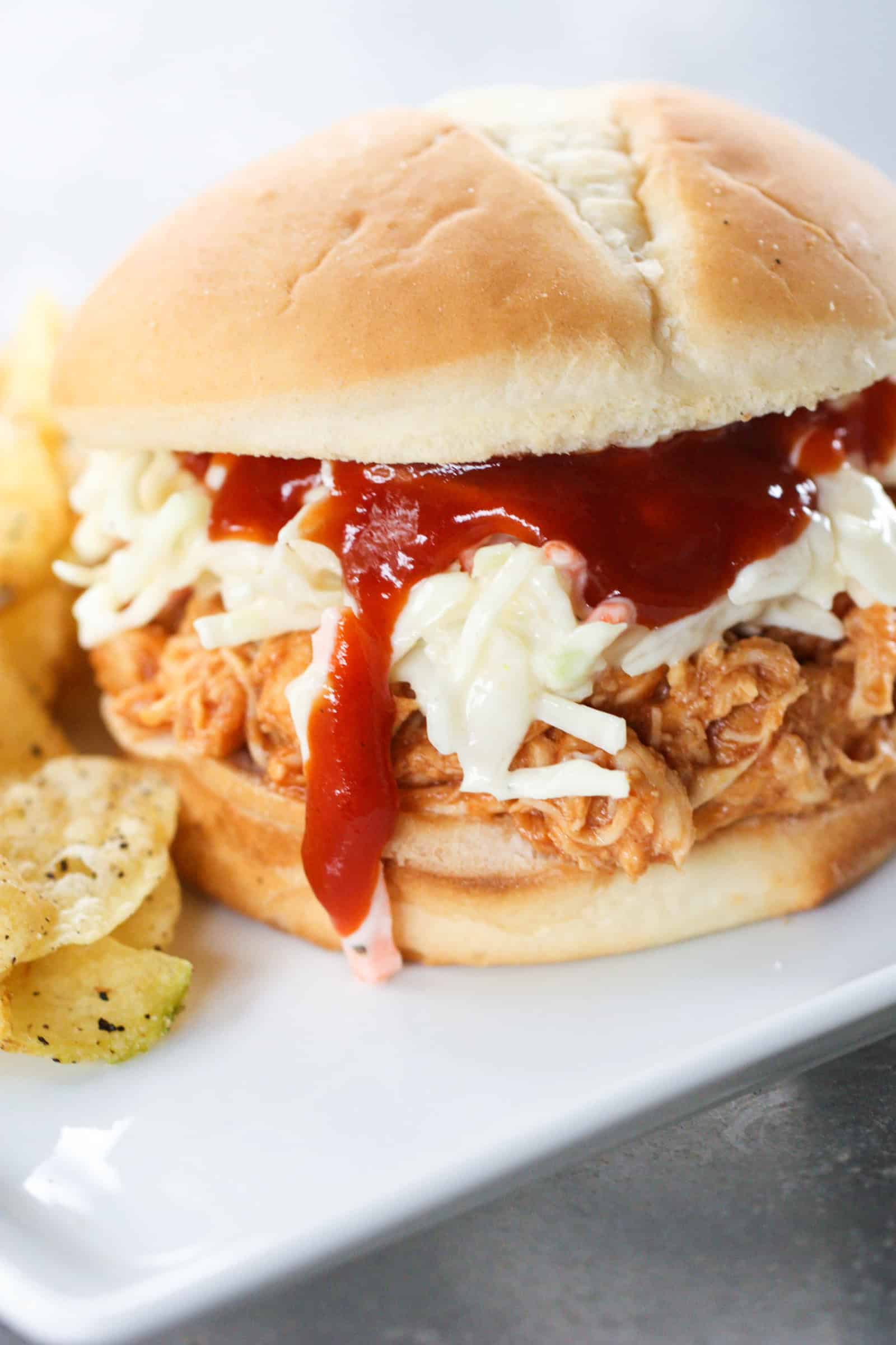 Slow Cooker Hawaiian Chicken Sandwich served on a white plate