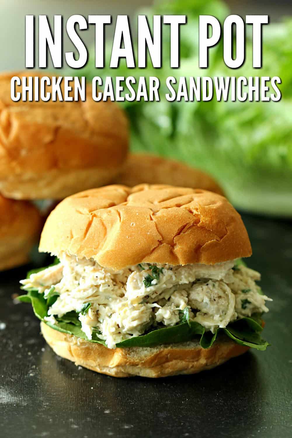 Instant Pot Chicken Caesar Sandwich on a black counter top