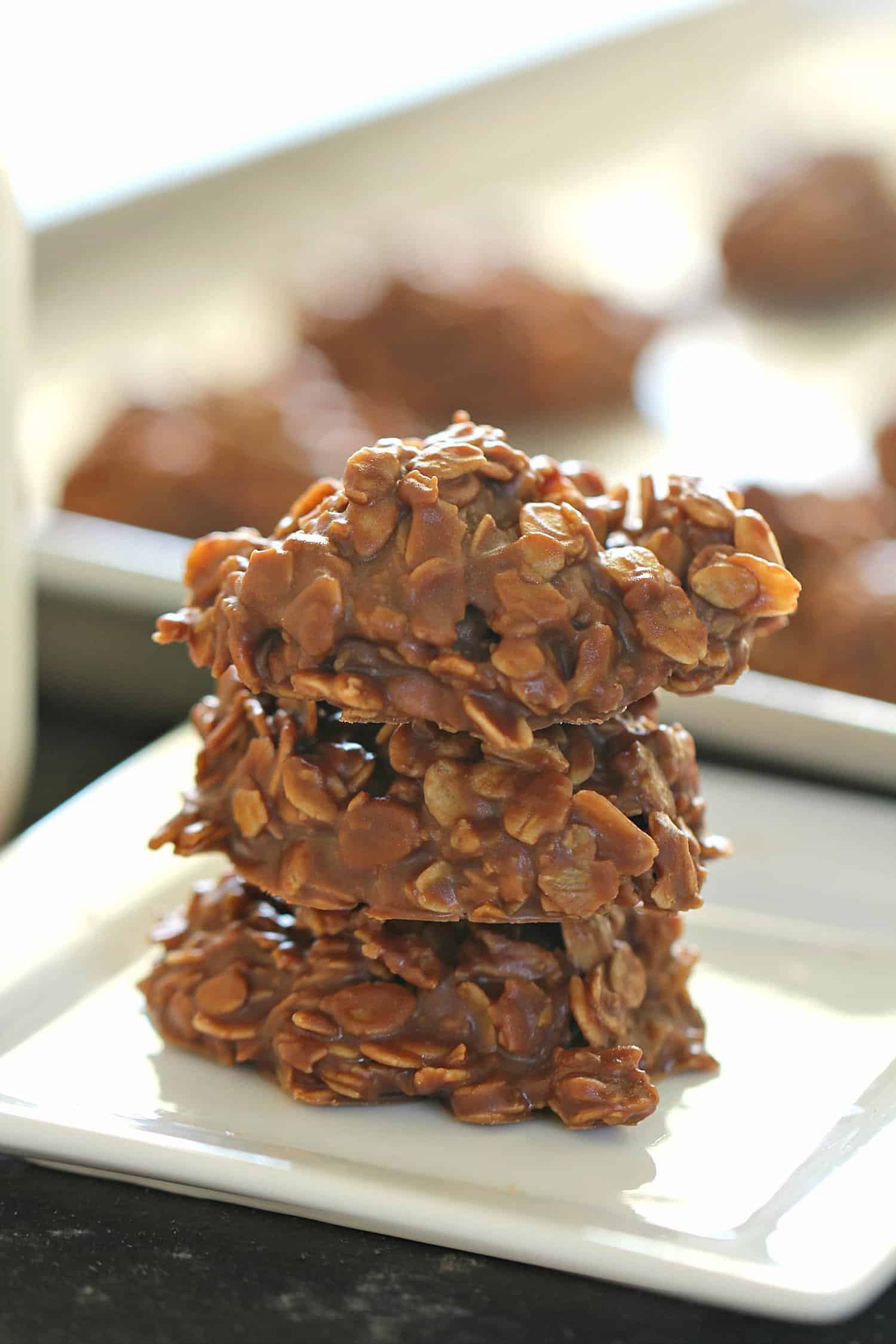Healthier No Bake Chocolate Peanut Butter Cookies stacked on a white plate