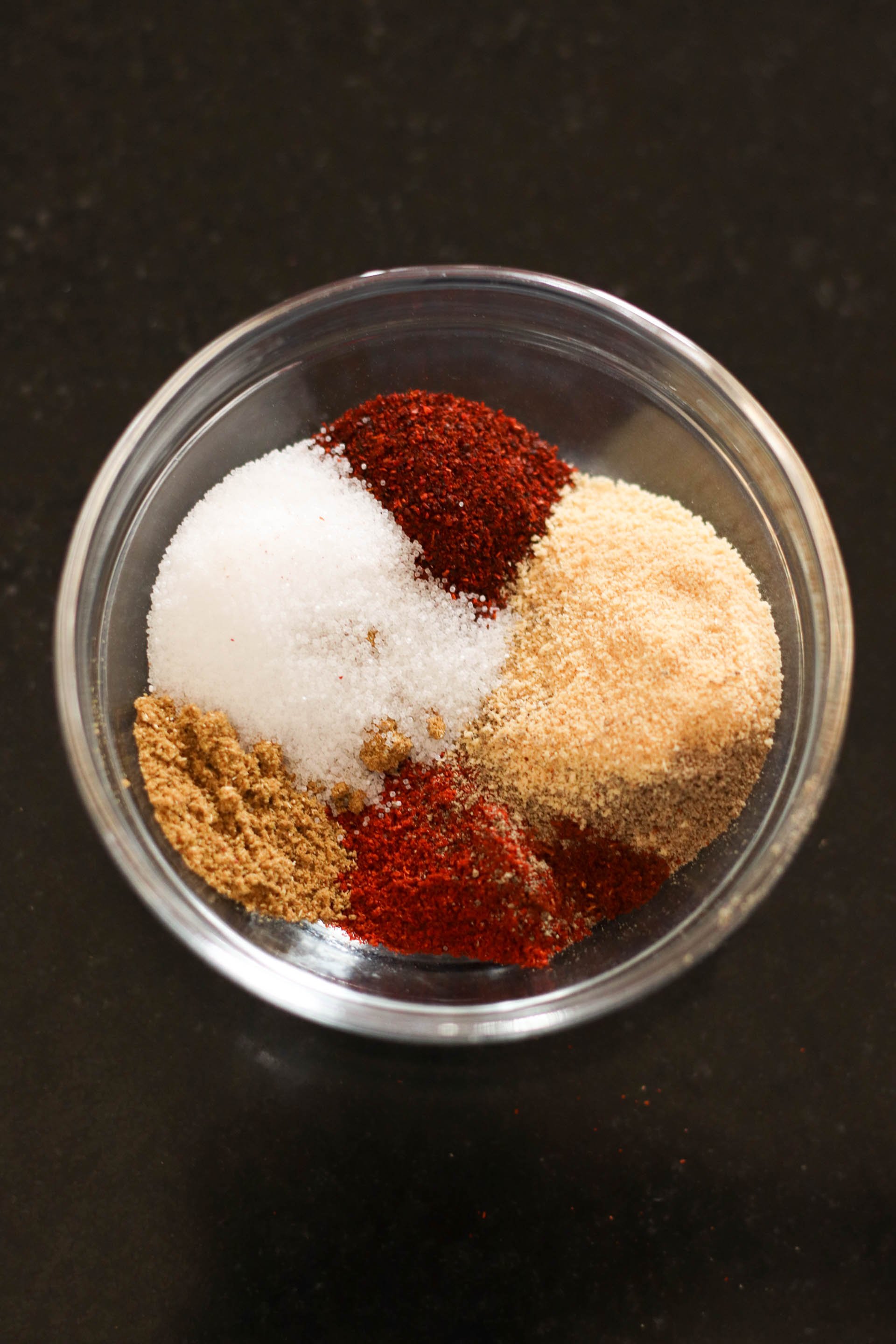 Seasonings for Spicy Honey-Glazed Chicken in a glass bowl