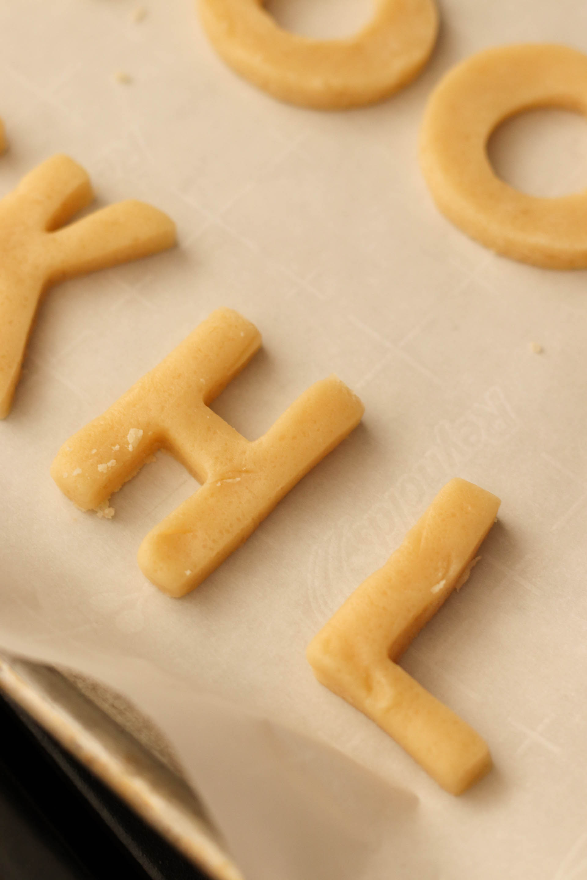 Unbaked Back-to-School Alphabet Sugar Cookies on baking sheet