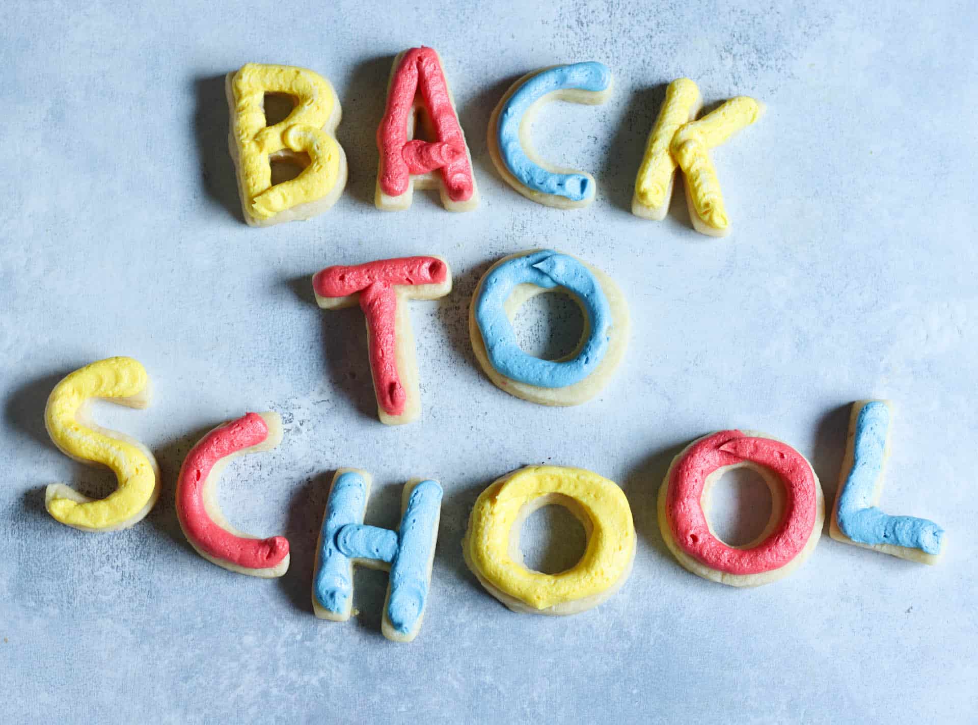 Sugar Cookies in the shape of letters and frosted. Spelling out Back To School.