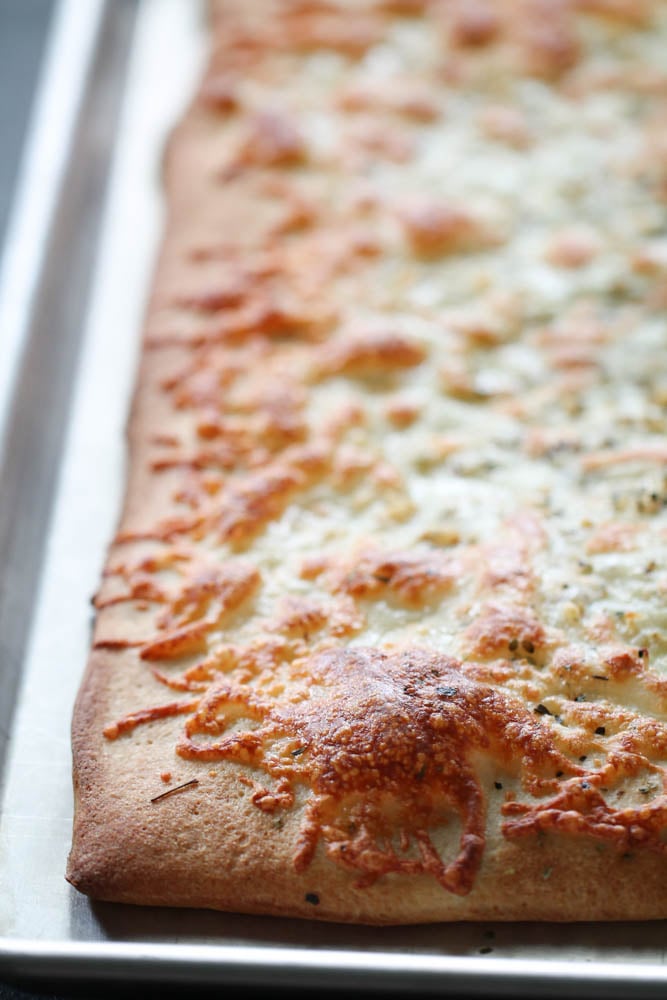 Cheesy Garlic Breadsticks on a baking sheet