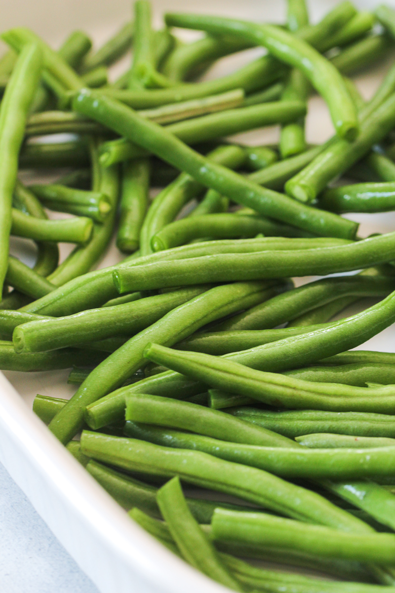 unbaked green beans in baking dish