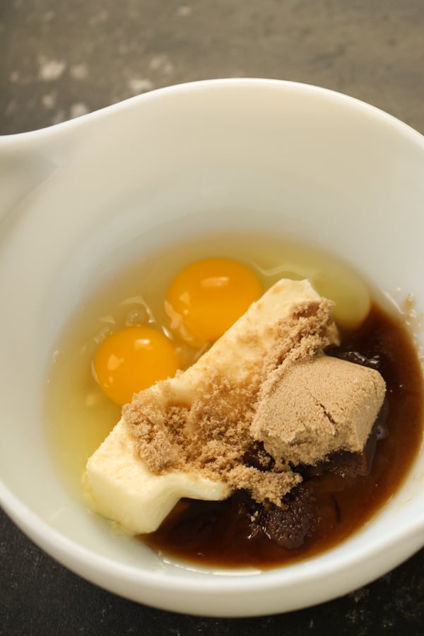 Butter, Sugar, Eggs and Vanilla in a mixing bowl