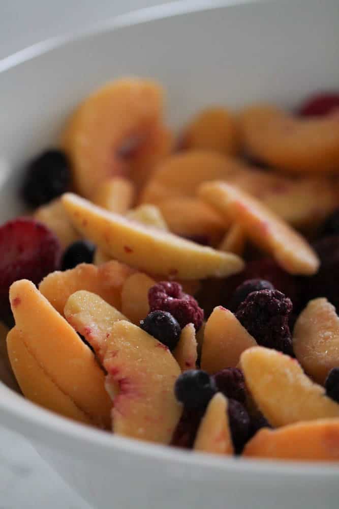Frozen fruit in mixing bowl.
