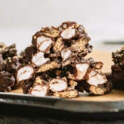 S’mores Clusters cut in half to show the insides on a baking sheet.