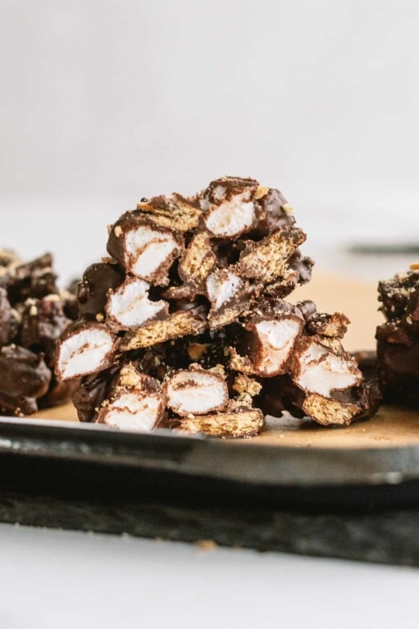 S’mores Clusters cut in half to show the insides on a baking sheet.