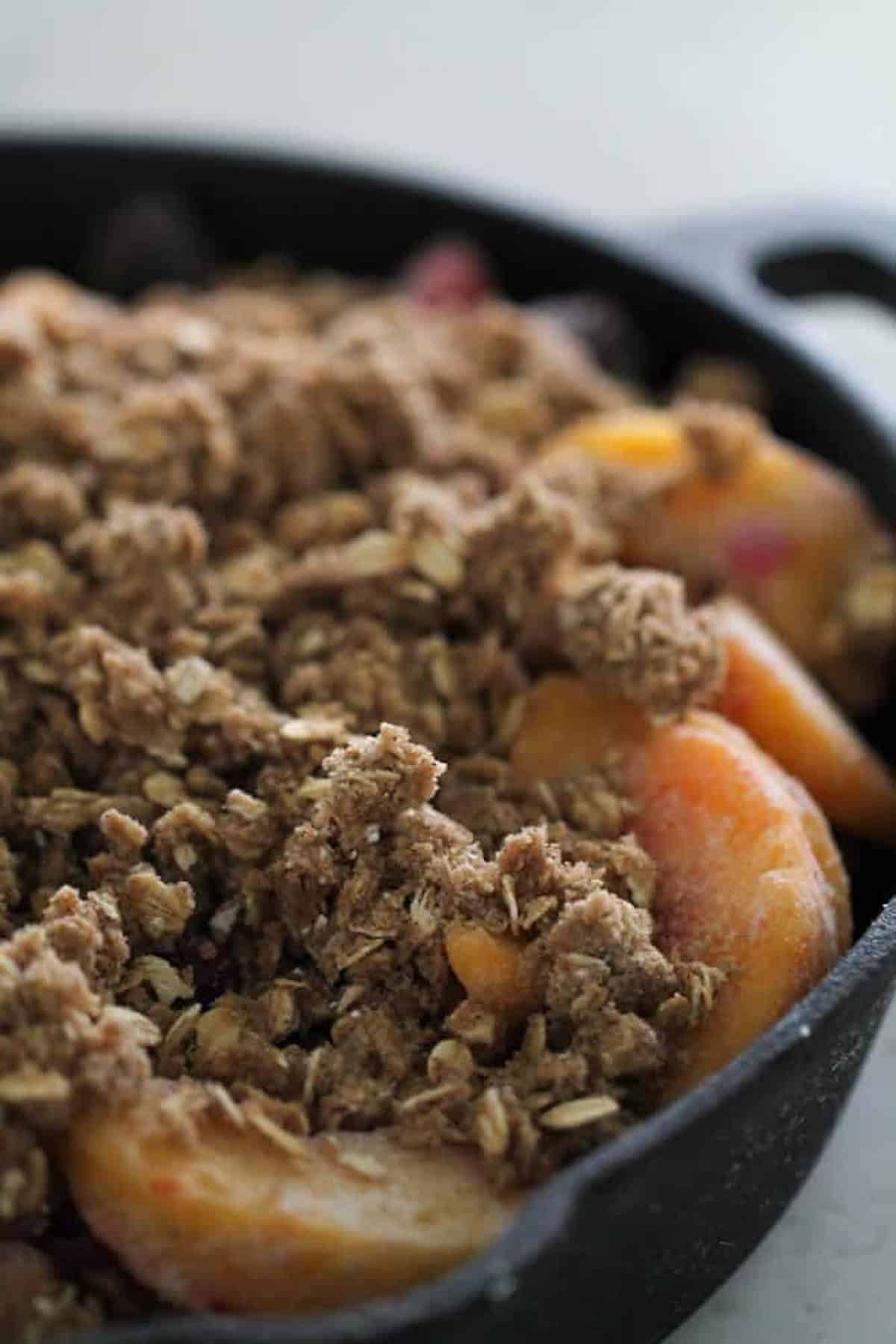 Fruit mixture placed in large skillet, sprinkled brown sugar mixtire on top.