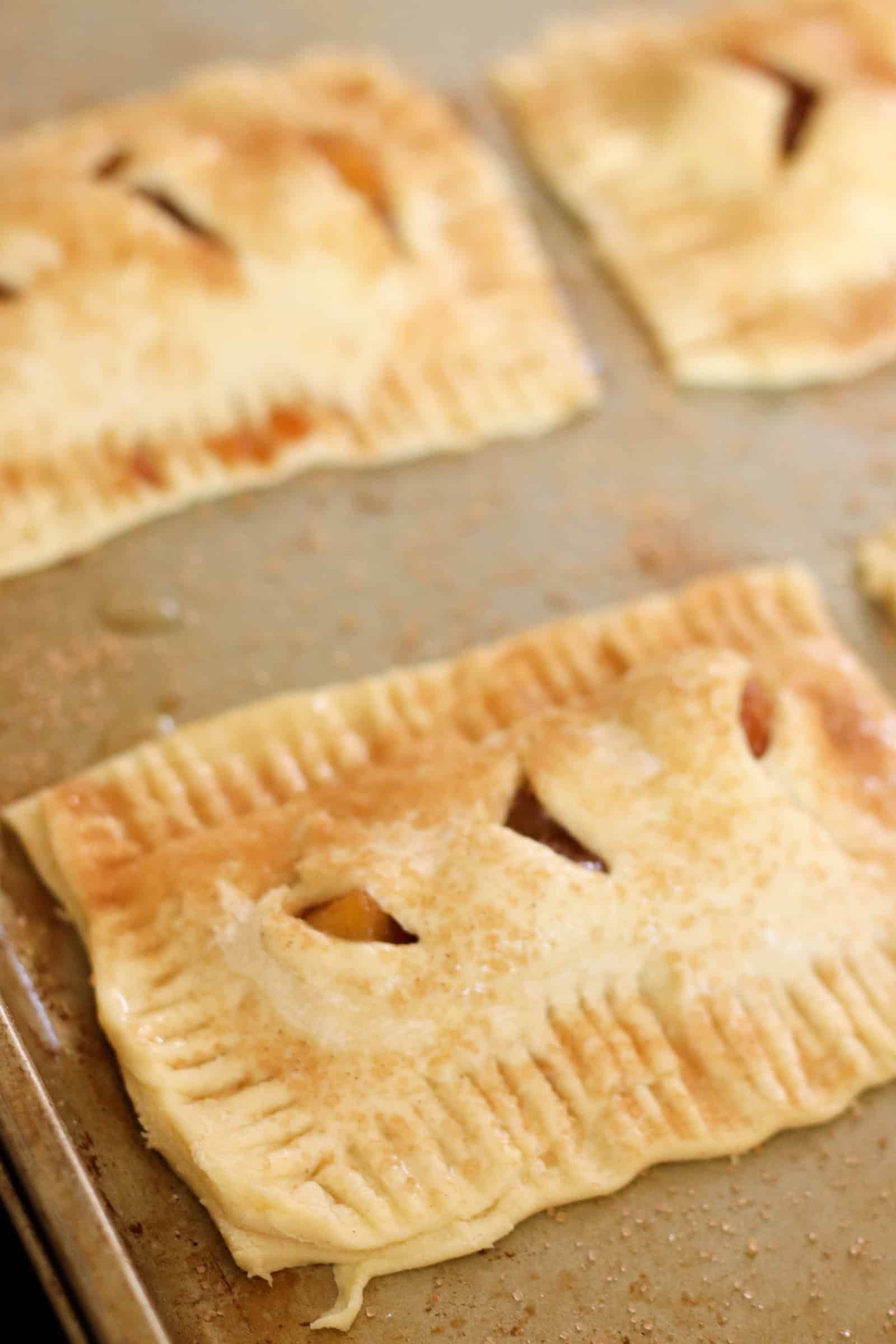 Unbaked Peach Hand Pies on baking sheet