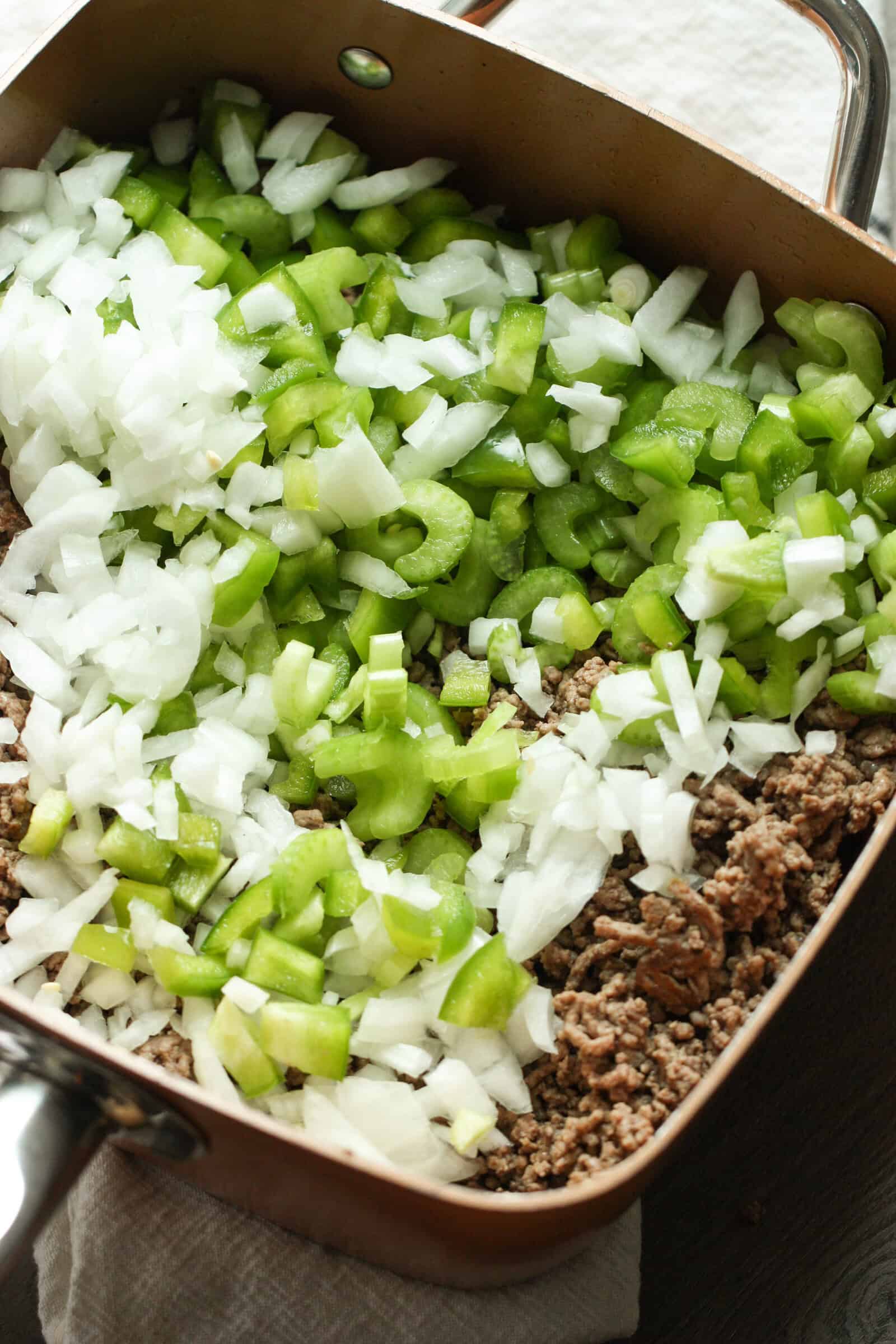 Meat and veggies added to pot