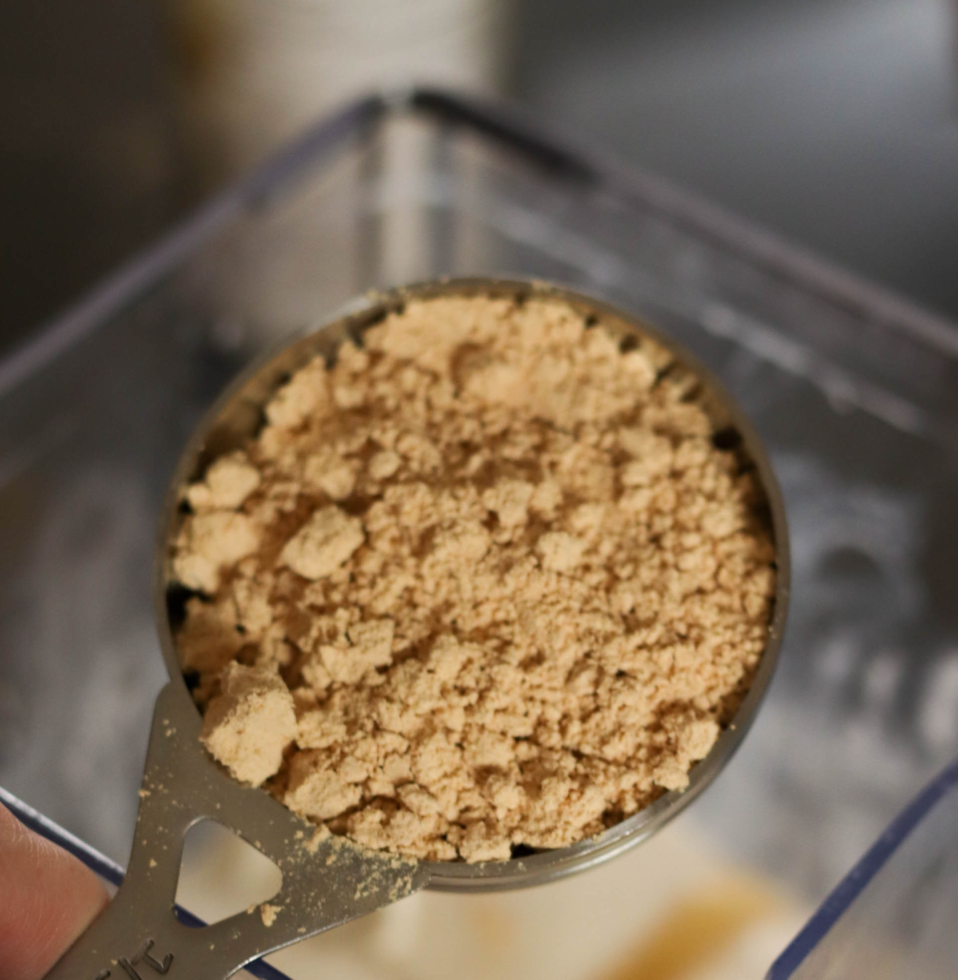 1/4 cup of powdered peanut butter in a measuring cup