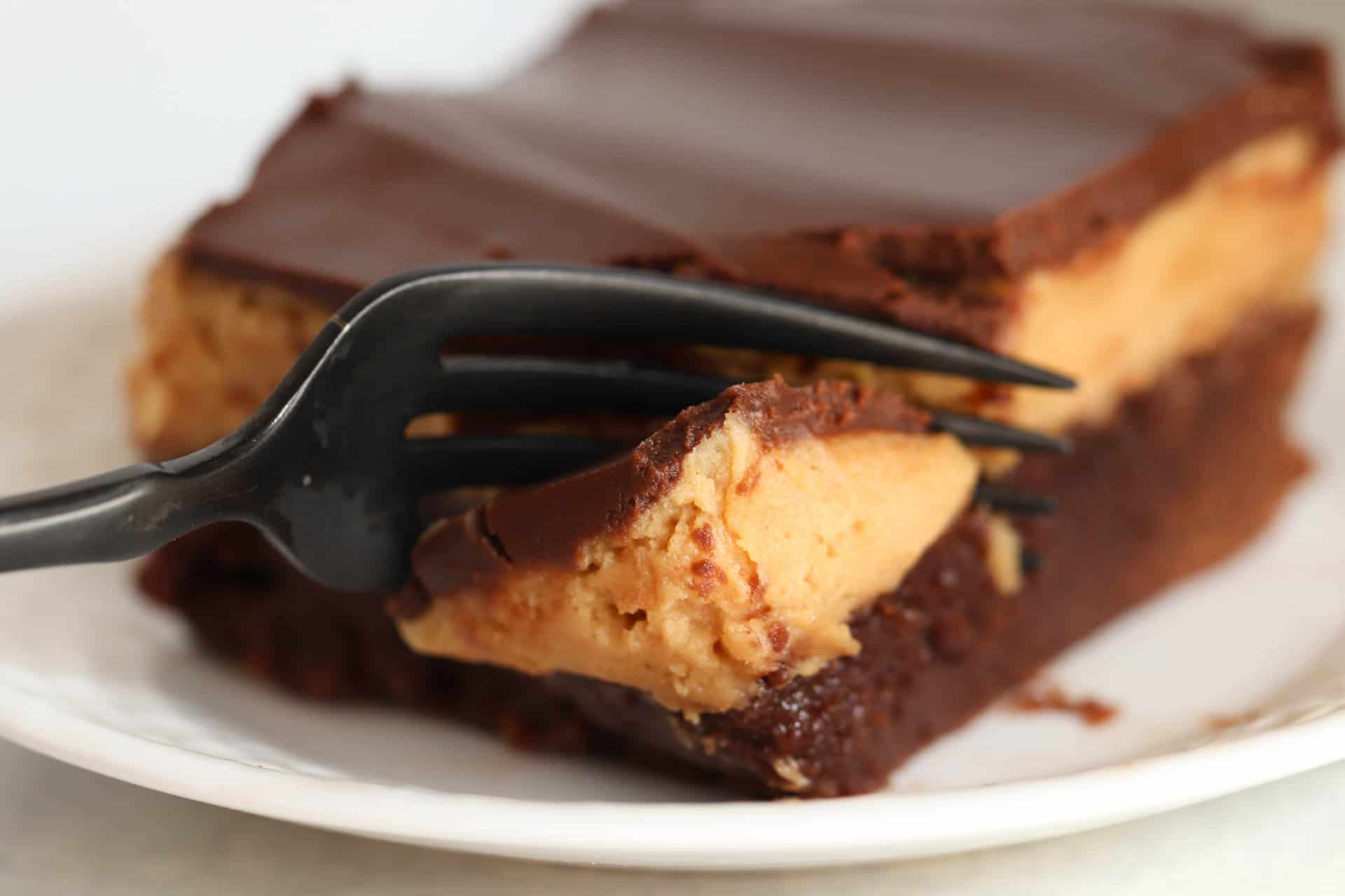 Buckeye Brownie Square on a white plate with a fork