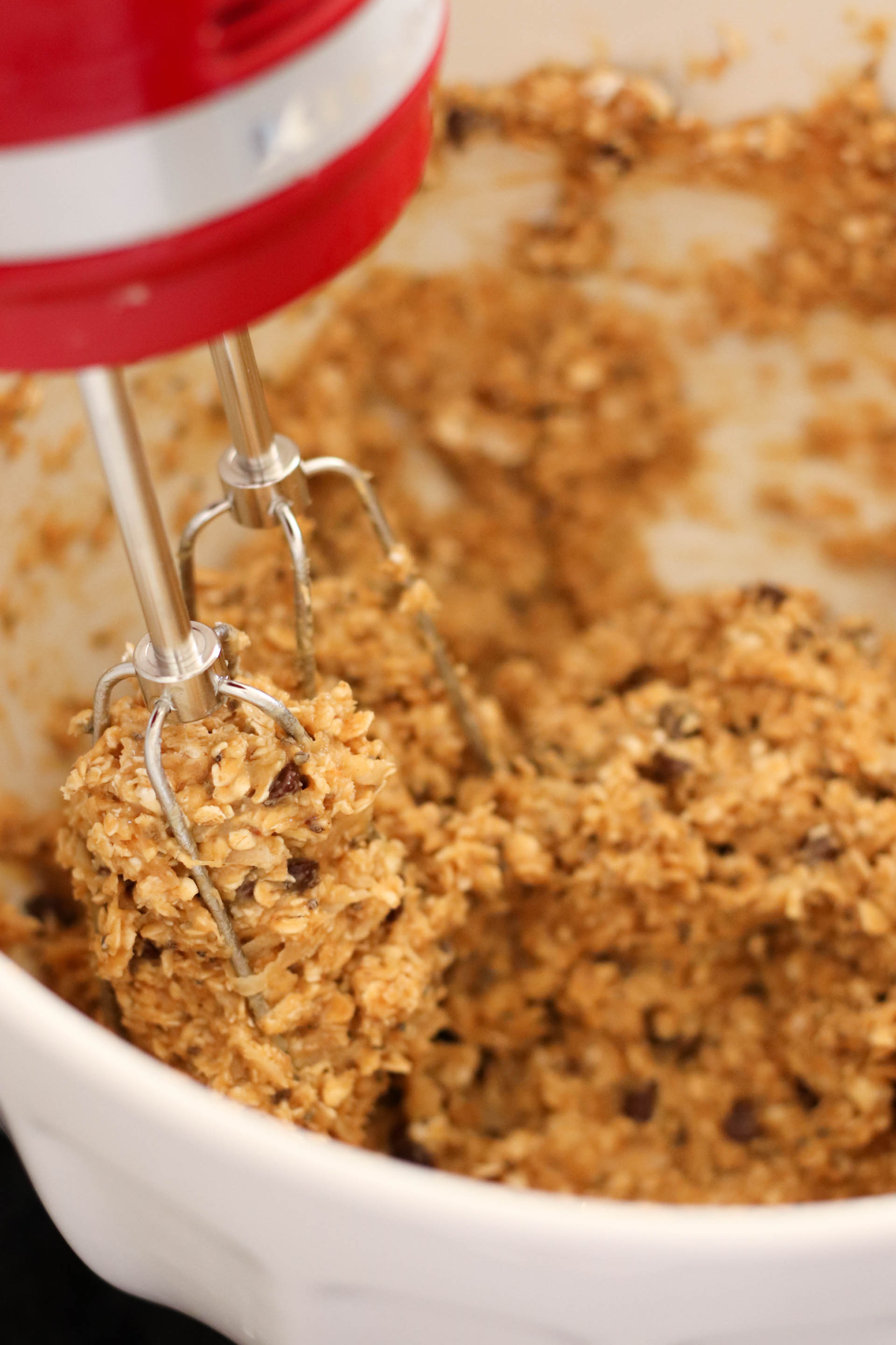 Cookie dough for Breakfast Cookies in a mixing bowl with a hand mixer