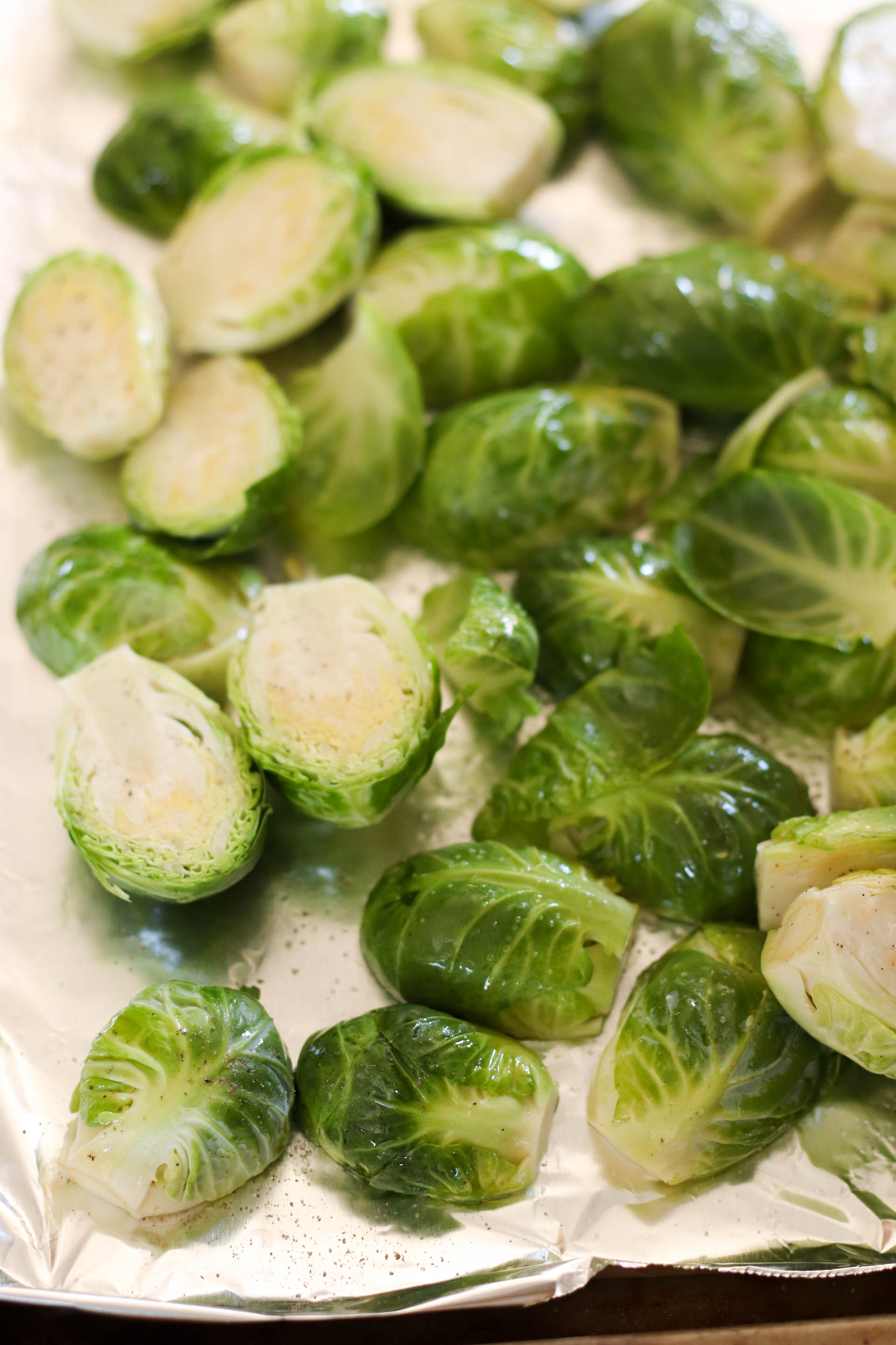 Brussel Sprouts halved on a baking sheet